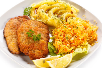 Fototapeta premium Pork chops, mashed potatoes and vegetable salad