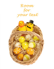 basket with easter eggs, isolated on white