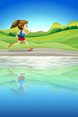 A girl running along the river