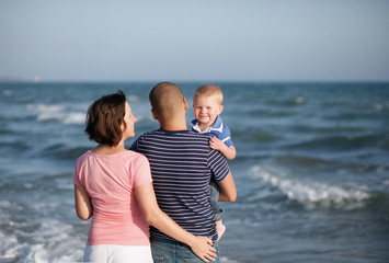 Family walking by the sea