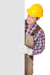Construction worker presenting empty banner