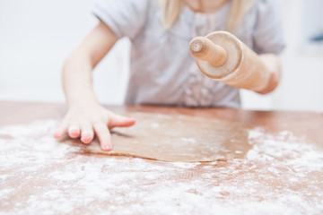 Young girl making gingerbread