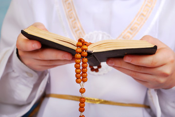 praying boy going to the first holy communion