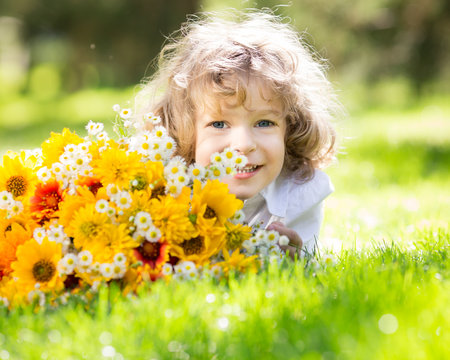Child with bouquet of flowers