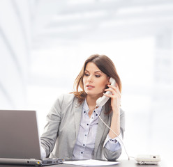A young and smart businesswoman working in the office