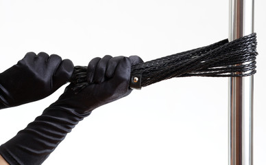 black gloves, whip and pole