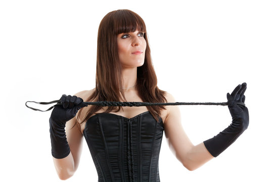 woman in a corset and  riding crop