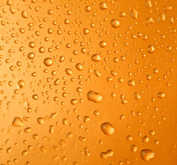 Abstract orange drops of water background