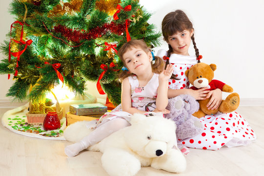 girls at a New Year tree