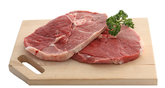 Tranches de gigot sur planche