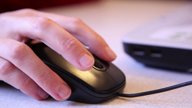 computer mouse in hand, woman, close-up