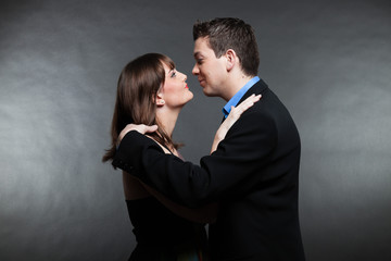 Romantic young couple in love. Man and woman. Studio shot.
