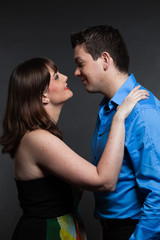 Romantic young couple in love. Man and woman. Studio shot.