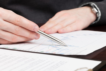 Business men reading contract