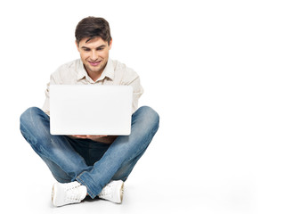 Portrait of  happy man working on laptop