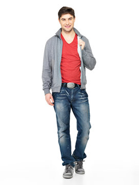 happy handsome man in grey jacket, blue jeans