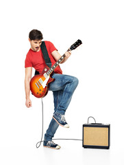 Guitarist man plays on the electric guitar