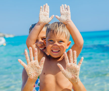 Girl and boy On Sand