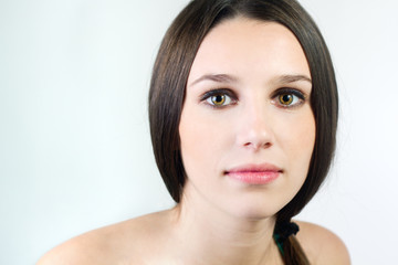 Portrait of beautiful young woman with clean skin