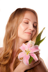 Obraz na płótnie Canvas Beautiful young woman with lily