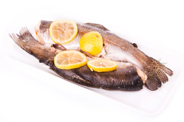 Trout with lemon cooked in a steamer. Healthy food concept.