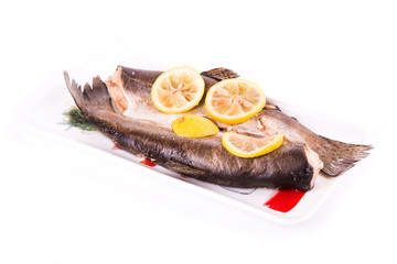 Trout with lemon cooked in a steamer. Healthy food concept.
