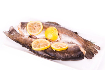 Trout with lemon cooked in a steamer. Healthy food concept.