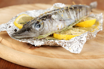 Fish in foil with herbs and lemon