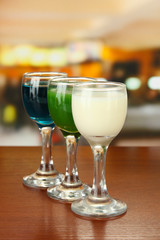 Tasty color liquors, on bright background
