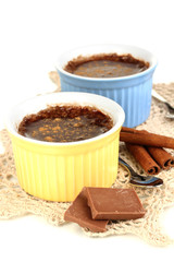 Chocolate pudding in bowls for baking isolated on white