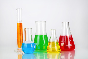 Test tubes with colorful liquids isolated on white