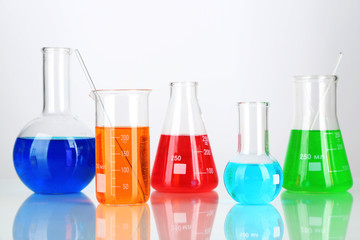 Test tubes with colorful liquids isolated on white