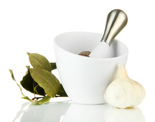 Mortar, herbs and garlic, isolated on white