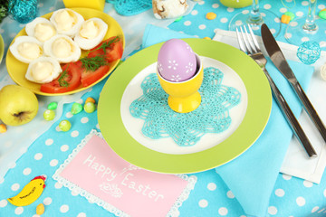 Serving Easter table with tasty dishes close-up