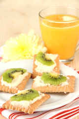 Tasty canapes with cheese and kiwi,