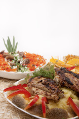 grilled pork with mashrooms and vegetable salad together with pa