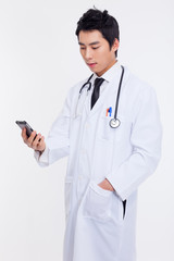 Young Asian doctor using smar phone