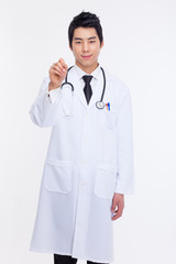 Young Asian doctor using pen