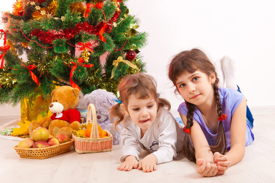 girls at a New Year tree
