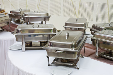 metal kitchen equipments on the table for fine wedding