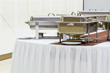 metal kitchen equipments on the table for fine wedding