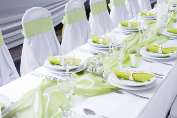table set for wedding dinner decorated with flowers