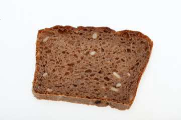 Fototapeta na wymiar Slice of dark bread isolated over white
