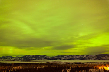 Green glow of Northern Lights or Aurora borealis