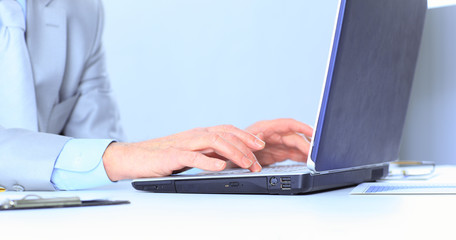 The businessman at the age of works for the laptop.