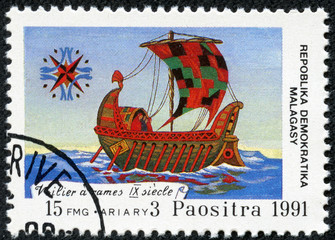 stamp printed in Malagasy shows Rowing sailboat