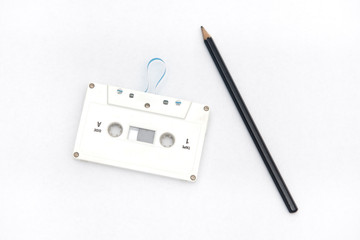 A pencil and an audio cassette tape