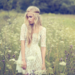 beautiful young girl in a summer field