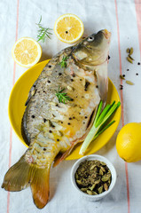 Fresh carp with lemon and spices