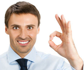 Businessman with okay gesture, isolated